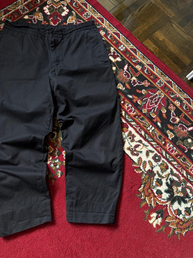 May include: Set of three ceramic mugs with a speckled, matte finish in cream, light grey, and dark grey. Each mug has a simple, minimalist design, suitable for coffee or tea.