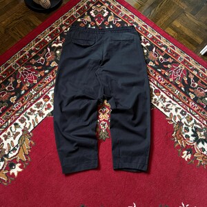 May include: A distressed wooden sign, reading "Welcome to our home" in white lettering. The sign has a rustic finish, ideal for adding a welcoming touch to a front door or hallway.