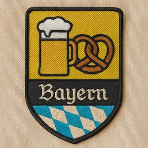 Bayern Aufnäher – Gestickter Bier & Brezn Patch mit Rautenmuster (ca. 8 cm)