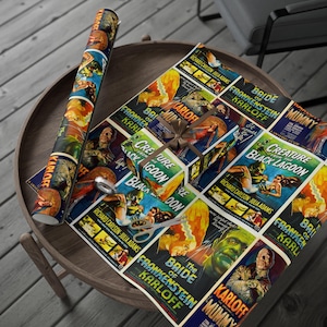 May include: Wrapping paper featuring vintage movie posters of classic horror films, including "Bride of Frankenstein", "Creature from the Black Lagoon", and "The Mummy".