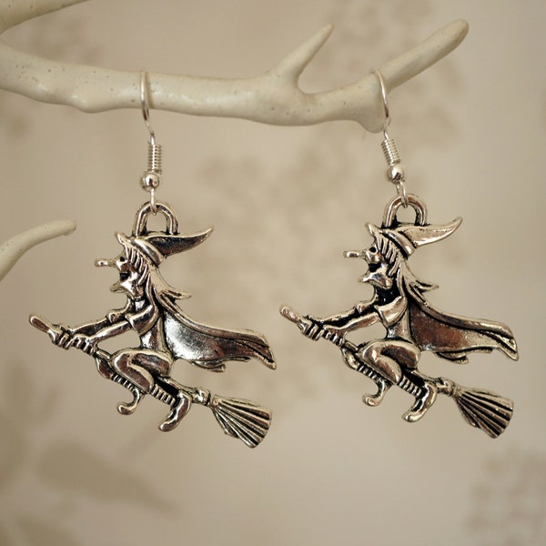 Witch on Broomstick Earrings, Novelty spooky Halloween silver witch on a broom drop earrings for women