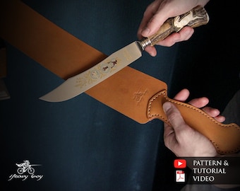 May include: A brown leather sheath with a stitched edge and a decorative design. A hunting knife with a stag horn handle and a detailed blade is placed in the sheath.