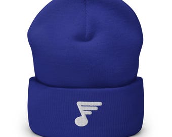 May include: A royal blue beanie with a white embroidered musical note with wings.