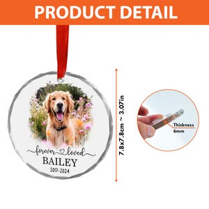 May include: A round, clear acrylic memorial ornament featuring a golden retriever in a field of flowers. The text reads "forever loved", "BAILEY", and "2017-2024". It hangs from a red ribbon and measures 3.07 inches in diameter with a 6mm thickness.