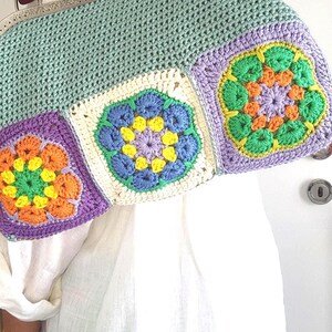 Materials: Cotton yarn, metal frame, acrylic handles