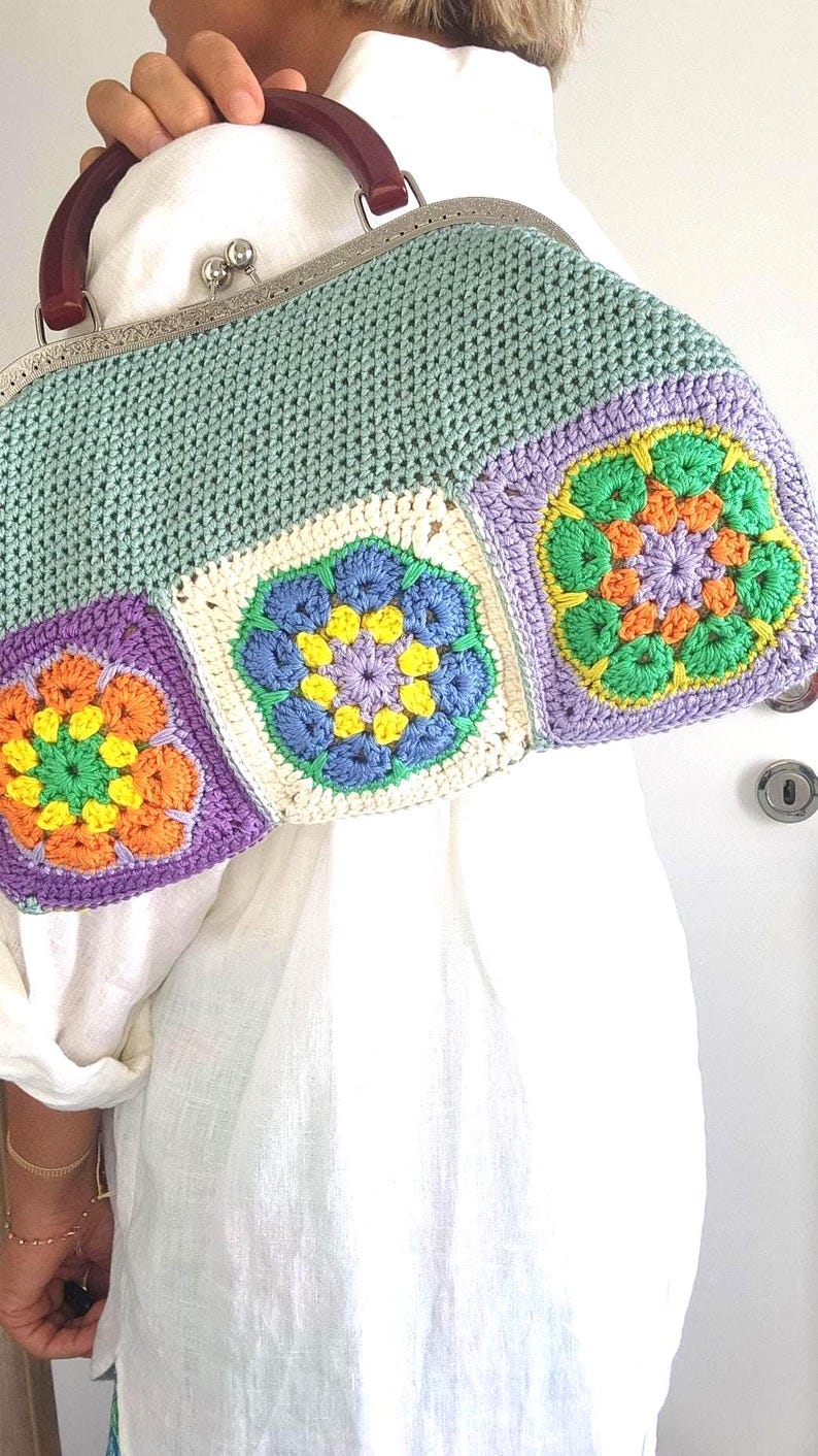 Materials: Cotton yarn, metal frame, acrylic handles