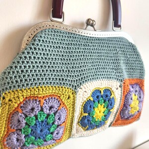 Materials: Cotton yarn, metal frame, acrylic handles