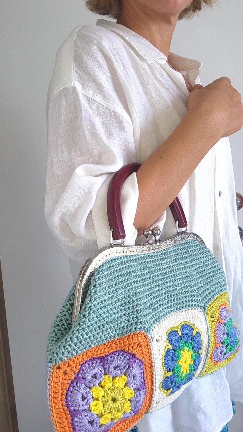 Materials: Cotton yarn, metal frame, acrylic handles