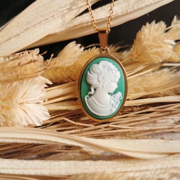 Gold necklace with large green and white face cameo