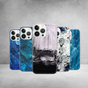 May include: Five different iPhone cases with abstract designs. The cases are all black, white, and blue. The designs include abstract brushstrokes, marble, and a splatter pattern.