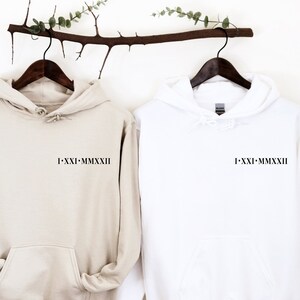 Roman Numeral Hoodies in Sand and white with an initial with a heart next to it