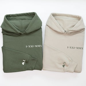 Roman Numeral Hoodies in green and Sand with an initial with a heart next to it