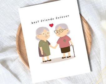 Puede incluir: Una tarjeta de felicitación con el texto "best friends forever" sobre una ilustración de dos mujeres mayores tomadas de la mano. Una lleva un vestido verde, la otra una camisa rosa y una falda marrón. Un corazón rojo está entre ellas.