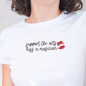 Support the Arts Baby Tee, Kiss a Musician Shirt, Music Lover Baby Tee, Coquette Y2K Baby Tee, Funny Graphic Tee for Girls, Band Groupie Tee