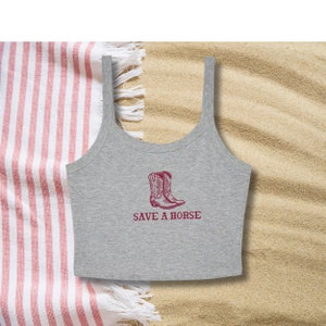 May include: A gray tank top with a red graphic of cowboy boots and the text "SAVE A HORSE".