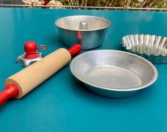 Toy rolling pin, cookie cutter, pans (angel food, pie, tart), c 1950s