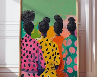 May include: A framed art print featuring four figures with dark hair, viewed from the back. They wear brightly colored, polka-dotted clothing in pink, yellow, orange, and green, set against a green background. The artwork is displayed on a wooden floor.