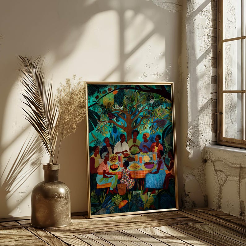 May include: A framed art print showing a colourful outdoor scene of people at a table. The artwork features a group of people seated around a table with food, under a large tree. The colour scheme includes greens, blues, and warm tones, creating a lively and inviting scene.