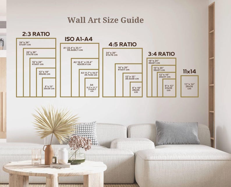 May include: A wall art size guide with different ratios and measurements in inches and centimeters. The guide includes 2:3, ISO A1-A4, 4:5, 3:4, and 11x14 ratios. The guide is displayed on a white wall with a couch and a table in the foreground.