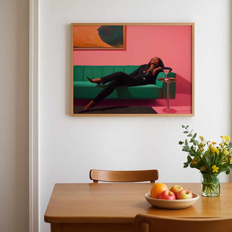 May include: A framed artwork featuring a person in a black suit reclining on a green sofa. A small side table holds a cocktail. The background is pink, with an abstract painting above the sofa. A wooden table with a bowl of fruit and a vase of flowers is in the foreground.