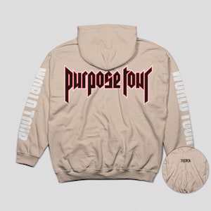 May include: A beige hoodie with a red and black "Purpose Tour" graphic on the back and "World Tour" text on the sleeves.