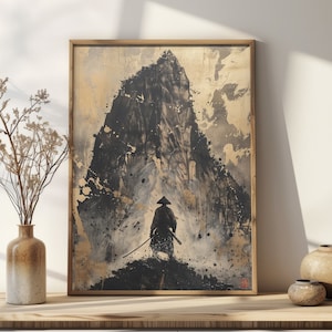 May include: A framed print of a black and white ink painting of a lone figure in a traditional Japanese hat standing in front of a mountain. The mountain is depicted in a stylized, abstract way with a textured background.