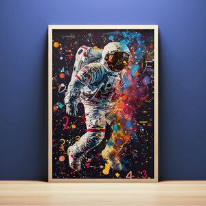 May include: A colorful abstract painting of an astronaut floating in space. The astronaut is wearing a white spacesuit with a red stripe down the side. The background is a dark blue with splashes of color, including red, yellow, green, and blue. The painting is surrounded by a black frame.