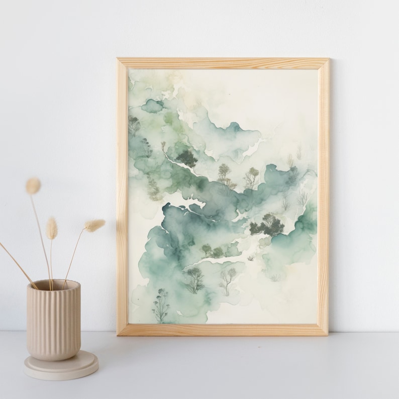 May include: A framed watercolor painting of a landscape with green and blue hues. The painting depicts a misty, abstract scene with trees and foliage.