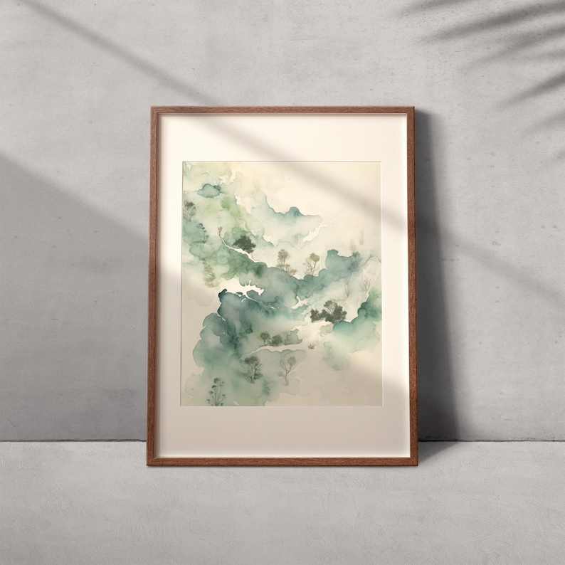 May include: A framed watercolor painting of a landscape with green and blue hues. The painting depicts a misty, forested scene with trees and hills.