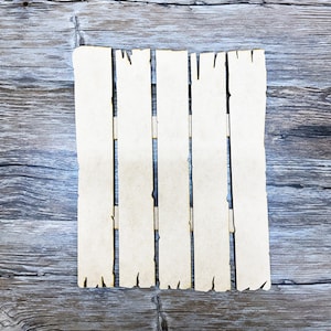 May include: A set of four unfinished wooden planks with a rough, distressed edge. The planks are arranged in a vertical row and are ready for painting or staining.