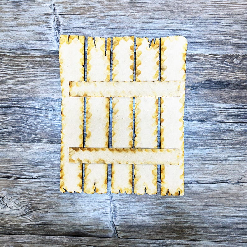 May include: A wooden slatted panel with a distressed, rustic look. The panel has a rectangular shape and is made of thin, light brown wood slats. The slats are arranged in a vertical pattern and are slightly uneven in length. The panel has a rough, unfinished texture and appears to be weathered.