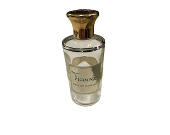 Frasco vacío de perfume Tianne Eau de Parfum vintage de Nettie Rosenstein, Nueva York, con tapón dorado.