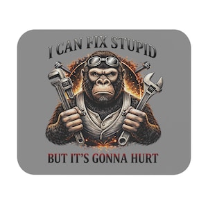 May include: A grey square coaster with a gorilla wearing goggles and holding spanners. The text "I CAN FIX STUPID BUT IT'S GONNA HURT" is printed above and below the gorilla illustration. The design has a mechanic theme.