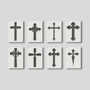 May include: Eight stencils featuring different cross designs. Each cross is cut out of a rectangular white card. The crosses vary in style, with some having ornate details and others being more simple.