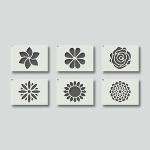 May include: Six black and white flower stencils on a grey background. The stencils are numbered 7 through 12.
