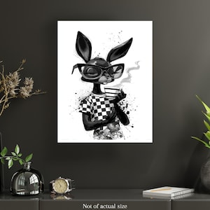 May include: Black and white art print featuring a rabbit character wearing sunglasses and a checkered shirt, holding a cup of coffee. The rabbit is depicted with a relaxed pose, with steam rising from the cup. The artwork has a modern, artistic style.