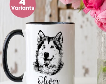 May include: White ceramic mug with a black handle and rim, featuring a black and white illustration of a dog's face and the name "Oliver" in script. A pink circle with "4 Variants" is in the background. Pink flowers in a glass jar are also present.