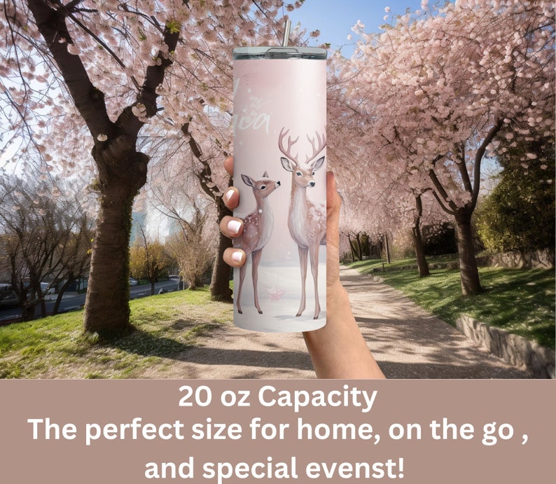 May include: A pink stainless steel tumbler with a white background and a design of two deer. The tumbler has a 20 ounce capacity. The text "20 oz Capacity" is printed below the image. The text "The perfect size for home, on the go, and special events!" is printed below the capacity text.