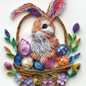 May include: A brown and white paper quilled bunny rabbit sits in a basket filled with colourful paper quilled Easter eggs. The basket is surrounded by green and purple paper quilled flowers.
