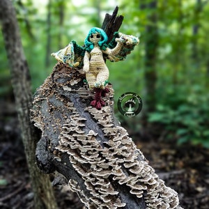 Amigurumi crochet doll pattern that is a cute harpy girl.