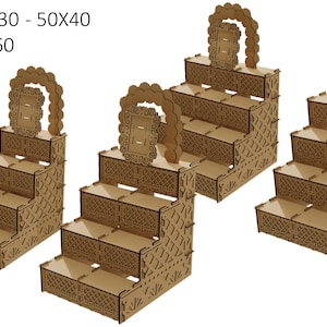 May include: Four wooden tiered display stands with intricate cut-out designs. The stands are in various sizes, with the largest stand having five tiers and the smallest stand having four tiers. The stands are made of brown wood and have a decorative arch at the top.