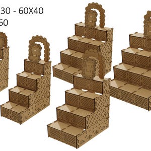 May include: Four wooden tiered display stands with decorative cutouts. The stands are 60x20, 60x30, 60x40, and 60x50, 60x60 inches.