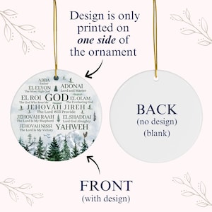 May include: A round white ceramic ornament featuring a printed design on the front and a blank back. The front displays a mountain and pine forest landscape with religious text including names of God like Abba, Adonai, El Roi, and Yahweh.
