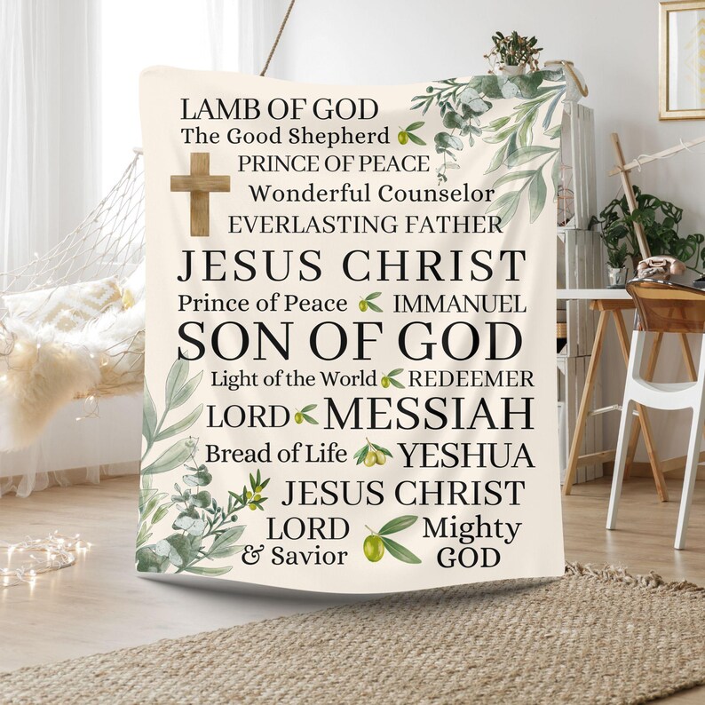 May include: A white tapestry with green foliage and olive branches. The tapestry features the text "LAMB OF GOD", "The Good Shepherd", "PRINCE OF PEACE", "Wonderful Counselor", "EVERLASTING FATHER", "JESUS CHRIST", "Prince of Peace", "IMMANUEL", "SON OF GOD", "Light of the World", "REDEEMER", "LORD", "MESSIAH", "Bread of Life", "YESHUA", "JESUS CHRIST", "LORD", "& Savior", "Mighty", "GOD".