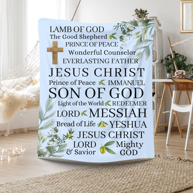 May include: A blue and white tapestry with a floral design and text that reads "Lamb of God, The Good Shepherd, Prince of Peace, Wonderful Counselor, Everlasting Father, Jesus Christ, Prince of Peace, Immanuel, Son of God, Light of the World, Redeemer, Lord, Messiah, Bread of Life, Yeshua, Jesus Christ, Lord, Mighty, & Savior, God".