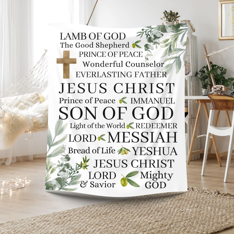 May include: White tapestry with green leaves and olive branches. The tapestry features the text "Lamb of God", "The Good Shepherd", "Prince of Peace", "Wonderful Counselor", "Everlasting Father", "Jesus Christ", "Prince of Peace", "Immanuel", "Son of God", "Light of the World", "Redeemer", "Lord", "Messiah", "Bread of Life", "Yeshua", "Jesus Christ", "Lord", "Mighty", "& Savior", "God".