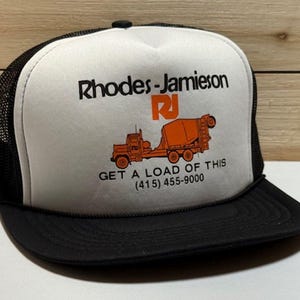 Vintage Trucker Mesh HAT &quot; Rhodes-Jamieson Get a Load of This&quot; & adjustable SnapBack White/Black By DG Sportswear Made In China