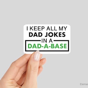 May include: White sticker with black text that reads "I keep all my dad jokes in a dad-a-base". The text "dad-a-base" is in a green rectangle.