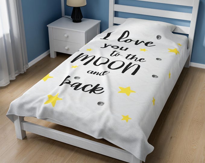 I Love You to the Moon and Back Velveteen Plush Blanket, its a warm hug and a heartfelt expression of love for your loved ones.