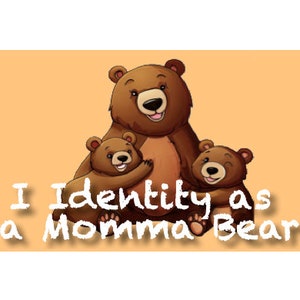 May include: A brown momma bear with two brown cubs. The momma bear has her arms around the cubs. The text "I Identity as a Momma Bear" is written in white on a light orange background.